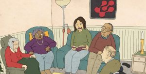 Fem personer sitter tillsammans i ett mysigt vardagsrum, en person läser högt medan de andra lyssnar och kopplar av.